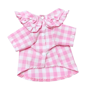 Back view of pink gingham dog dress with ruffle collar and bow detail at waist