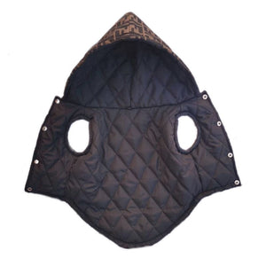 Interior view of quilted dog vest showing diamond stitch pattern and snap button details