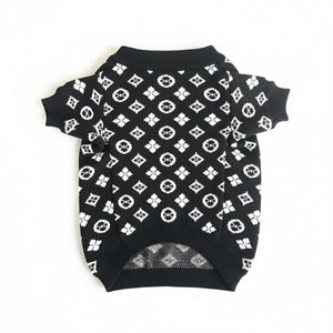 Back view of black monogram dog sweater with white V pattern and ribbed hem