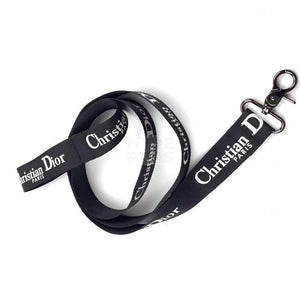 Black dog leash with white Christian Dior inspired text branding and metal clasp hardware