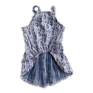 Back view of oblique print dog dress showing pleated skirt construction Dior style