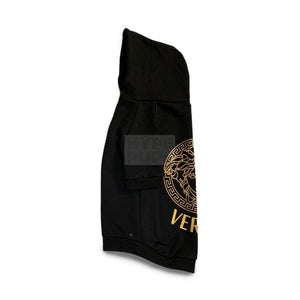 Side view black dog hoodie with gold baroque Medusa print and adjustable hood