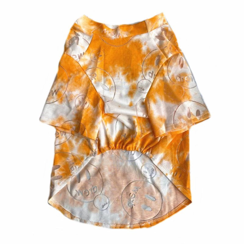 Orange and white tie dye dog tee with Drew smiley face graphics on white background