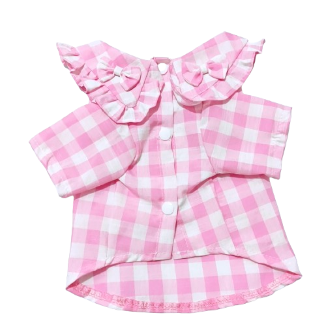 Back view of pink gingham dog dress with ruffle collar and bow detail at waist