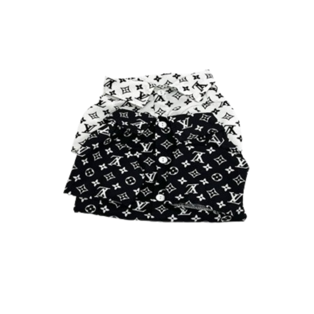 White and black V monogram polo shirts stacked showing collar detail