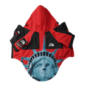 Red and black Supreme North Face style dog windbreaker with Statue of Liberty print