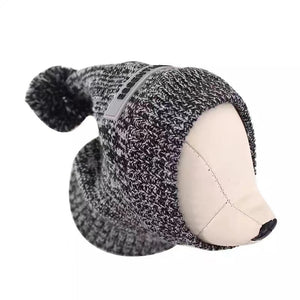 Gray knit dog hat with pom-pom Fear of God Essentials beanie on mannequin