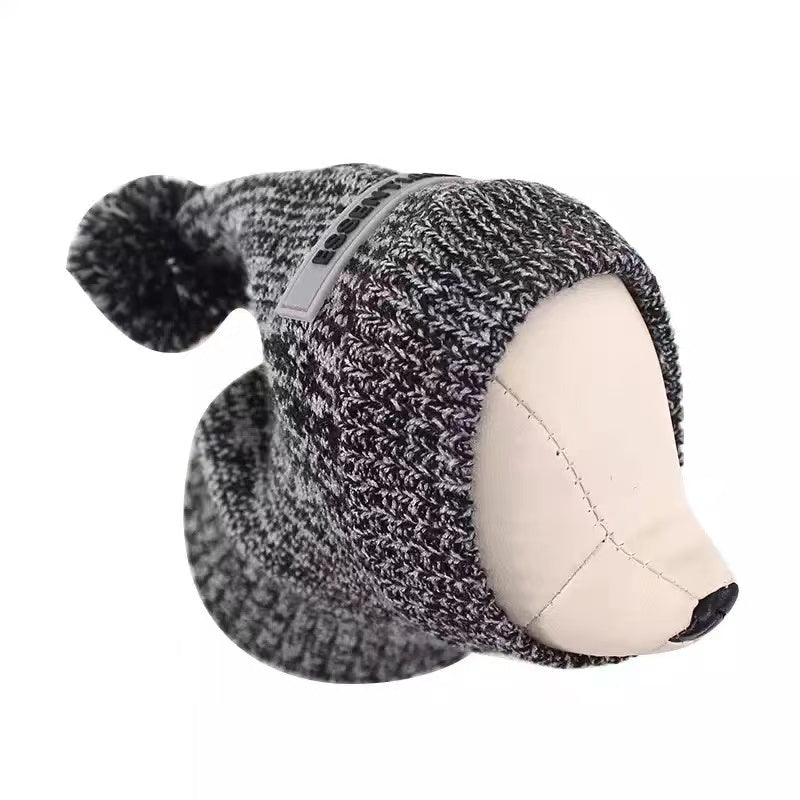 Gray knit dog hat with pom-pom Fear of God Essentials beanie on mannequin
