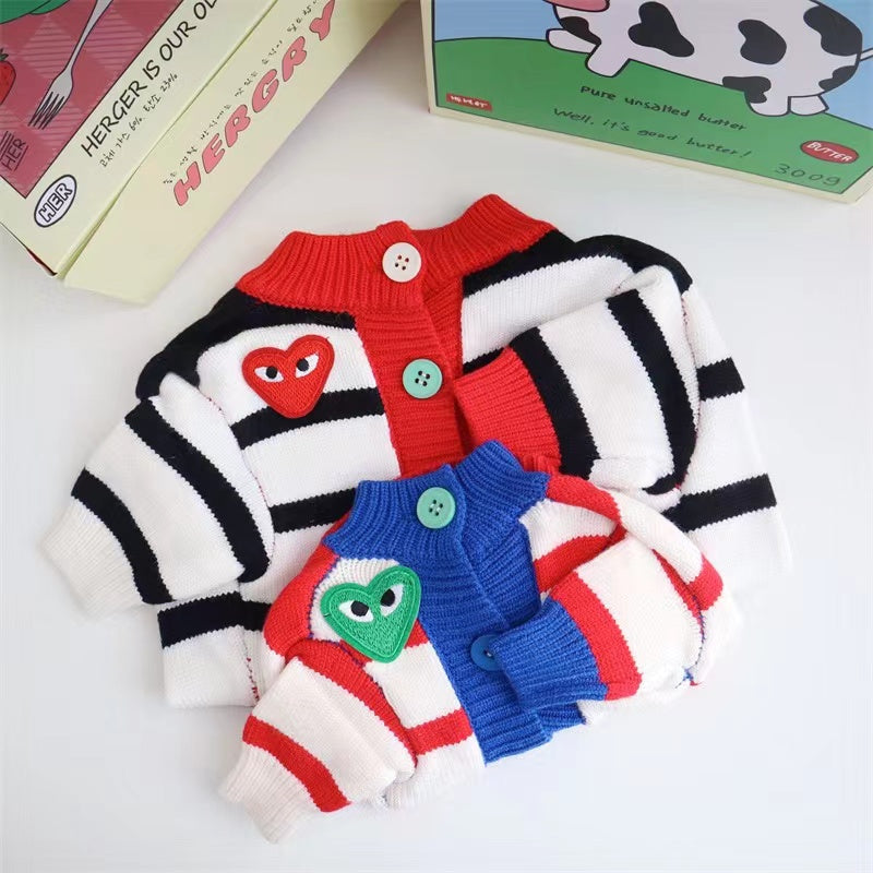 CDG striped cardigans in black/white and red/white colorways with heart logos
