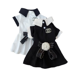 Black and white Chewnel dog dresses with structured collars and logo details inspired by Chanel