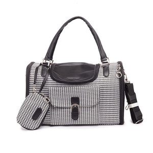 White crocodile pattern dog carrier with dual carrying handles and shoulder strap