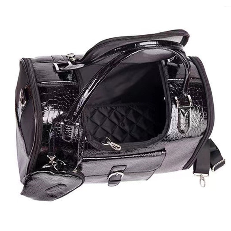White structured dog carrier with crocodile embossed surface and gold hardware