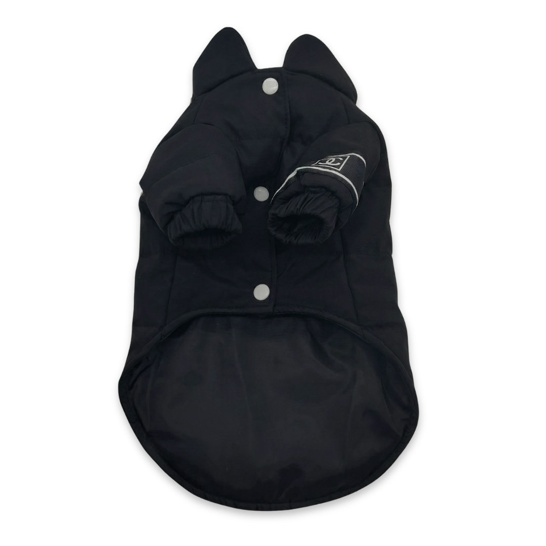 Black puffer vest with Chanel inspired logo detail and snap closure