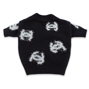 Back view of black Chanel inspired dog cardigan showing fringe logo pattern