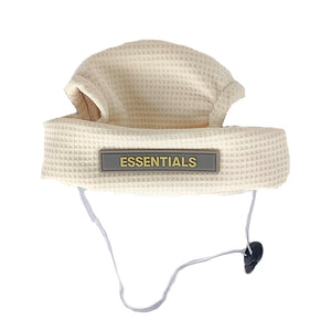 Cream waffle textured dog bucket hat with ESSENTIALS logo plaque Fear of God style