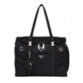 Black nylon dog travel carrier with Prada triangle logo and mesh ventilation panels