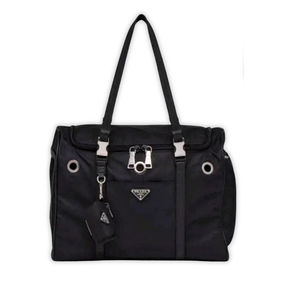 Black nylon dog travel carrier with Prada triangle logo and mesh ventilation panels