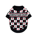 Black and white checkered dog sweater with red hearts and Dogior branding on white background