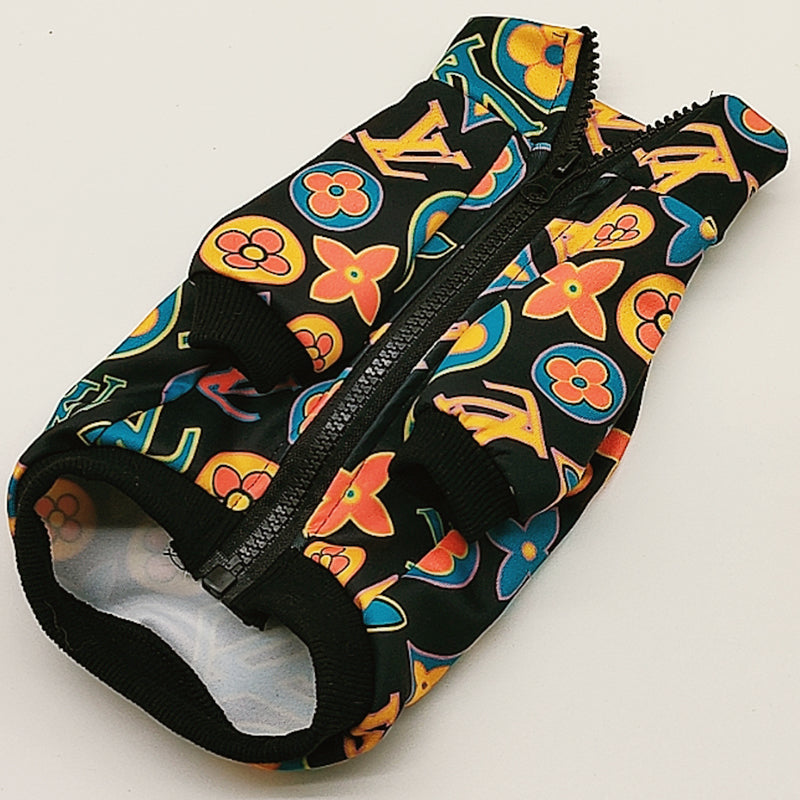 Flat lay black designer dog jacket with vibrant V monogram print and ribbed trim