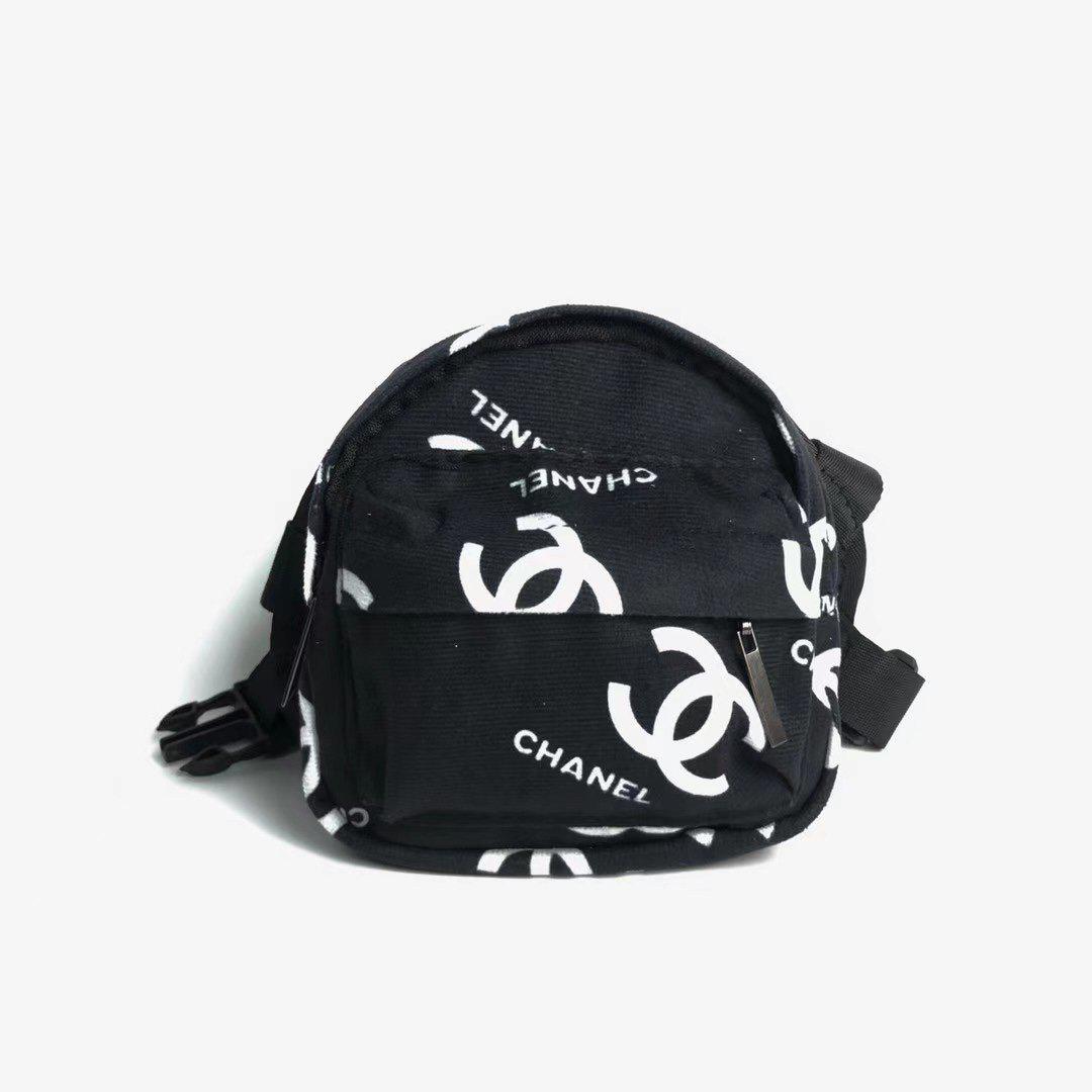 Black canvas dog backpack with Chanel style interlocking logo pattern