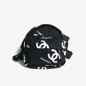 Black canvas dog backpack with Chanel style interlocking logo pattern