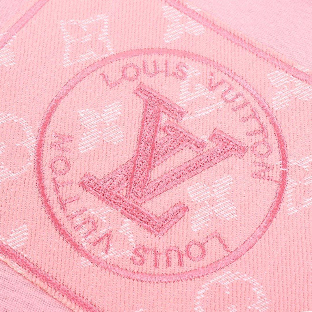Close-up of embroidered V monogram circular patch with Louis Vuitton inspired design