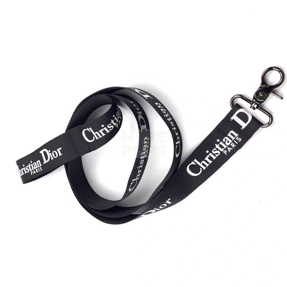Black dog leash with white Christian Dior inspired text branding and metal clasp hardware
