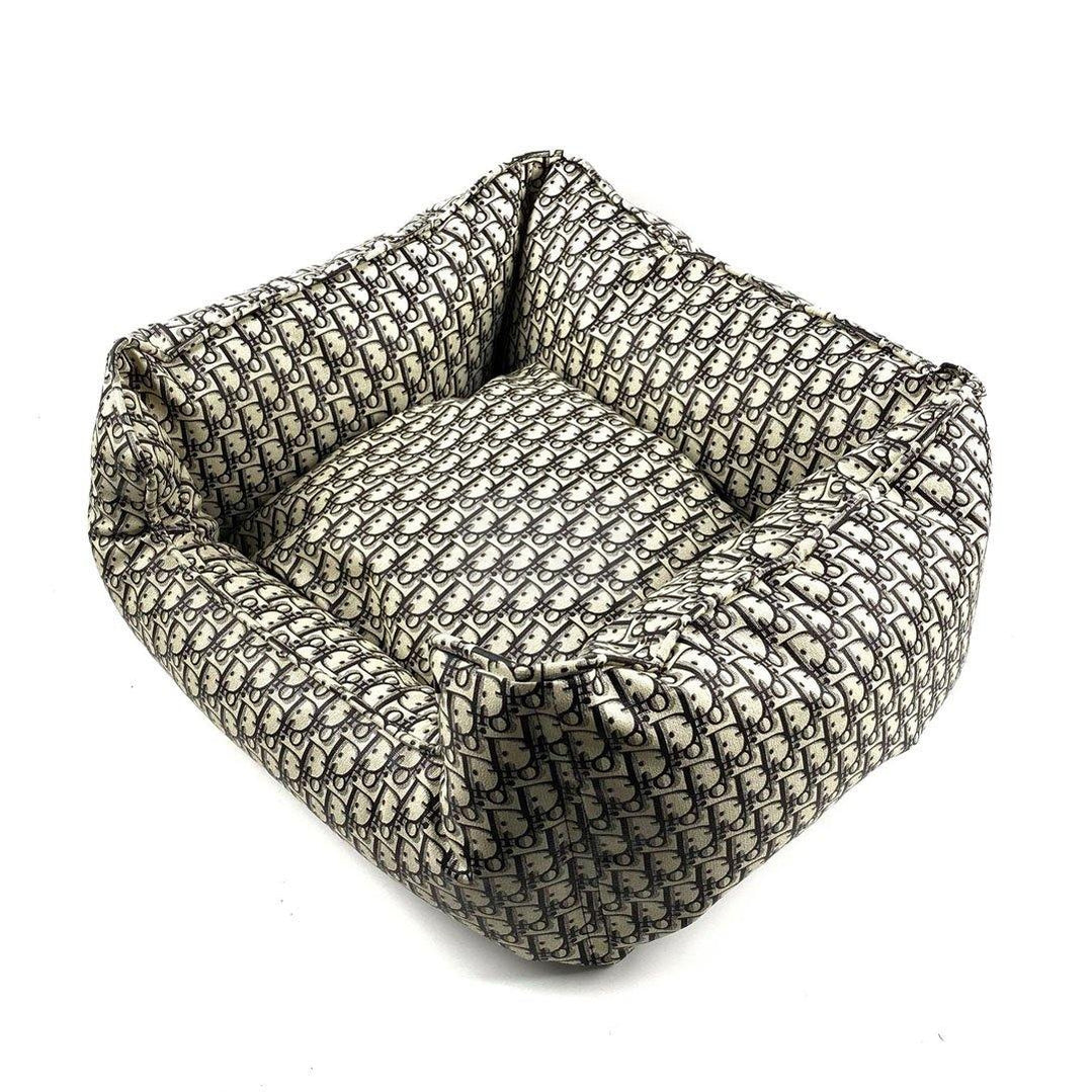 Square luxury dog bed with removable cushion showing Dior inspired oblique monogram print