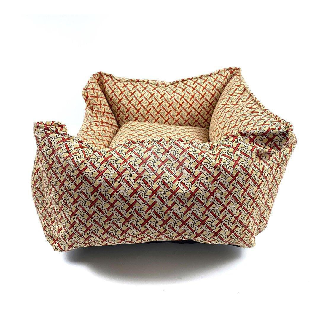 Designer dog bed with Burberry inspired monogram pattern in brown and cream