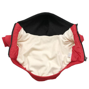 Interior view of red Yankees dog jacket showing cream lining and ribbed trim