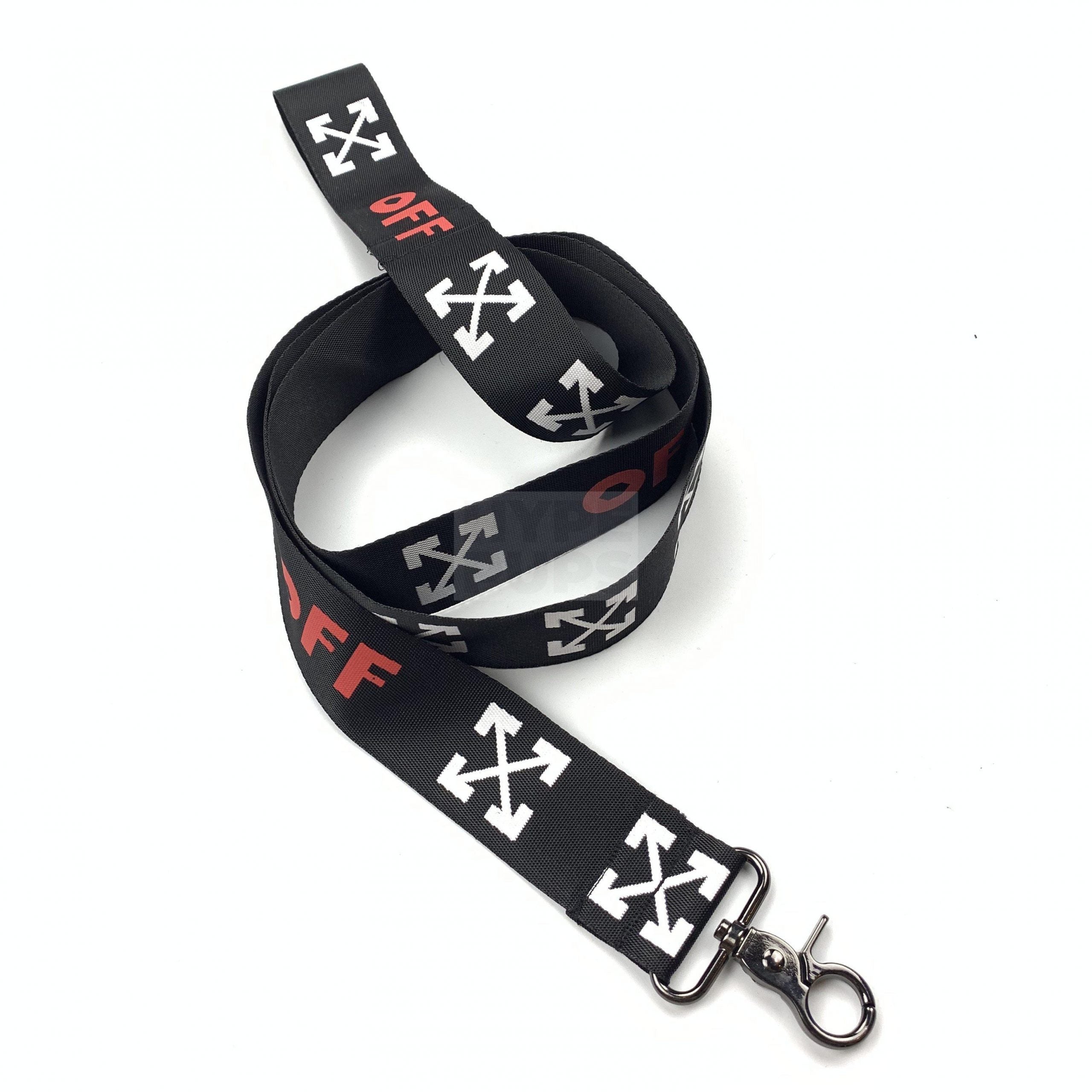 Close up of black dog leash with white arrow pattern and red OFF branding Off-White style
